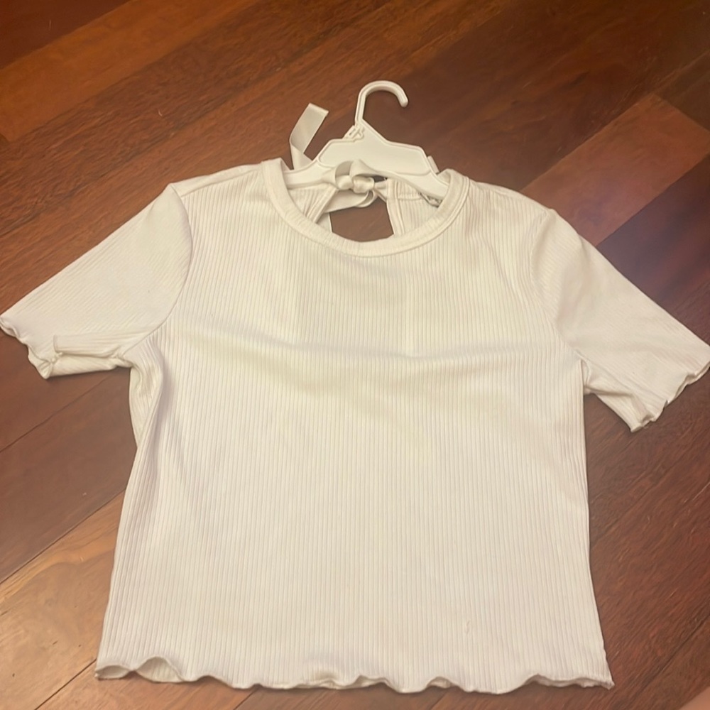 i am selling a cute white shirt with a open back that you can tie!